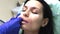 Doctor dermatologist cosmetologist performs lips massage after contour plastic
