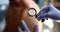 Doctor dermatologist examining rash on skin with magnifying glass closeup 4k movie slow motion