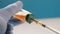Doctor dials in syringe opium painkiller for patient