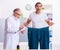 Doctor dietician and happy patient wearing large trousers