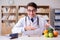 The doctor in dieting concept with fruits and vegetables