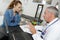 Doctor in discussion with young female patient