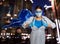 Doctor dressed as superhero on night city background. Medical workers fighting with dangerous diseases