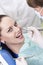 Doctor drills patient teeth