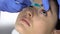 Doctor dripping medicine into patient eyes, eyesight checkup, dryness of eyeball