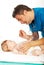 Doctor examine baby neck for sore throat