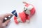 Doctor examines soft rabbit toy with neurological hammer and checks reflexes in feet. Concept for neurological examination of neur