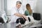 Doctor Examining Border Collie On Table