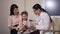 Doctor examining ear of toy dog and child