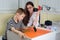 Doctor Examining Little Boy\'s Logical Thinking With Colored Geometric Shapes in Consulting Room