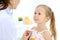 Doctor examining a little girl by stethoscope. Happy smiling child patient at usual medical inspection. Medicine and