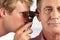 Doctor Examining Male Patient\'s Ears