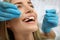 Doctor examining patient`s teeth, closeup. Cosmetic dentistry