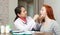 Doctor examining throat of teen patient