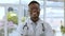 Doctor face, black man and proud in a medical, healthcare and wellness hospital. Professional portrait, happiness and