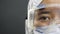 Doctor face portrait, asian epidemiologist. Close up eye, look seriously.