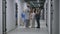 Doctor and family with little child stand in hospital corridor