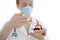 Doctor with flu vaccine syringe and toy pig