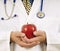 Doctor Gently Holding Red Apple