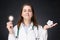 Doctor with glowing light bulb and crumpled paper