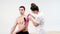 The doctor glues a special treatment tape to mail shoulder. Physiotherapist sticks kinesio tapes to the shoulder of