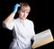 Doctor in gown and rubber gloves reading a medical book to confirm that his patient is in excellent health