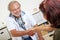 Doctor greets patient with handshake