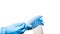 Doctor hand in blue sterile glove holds sealed bag and give cotton swab.