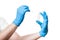 Doctor hand in a blue sterile gloves to give cotton swab.
