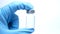Doctor hand in Medical gloves blue to hold coronavirus Antiviral vaccine bottle
