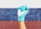 Doctor hand in protective glove with a mask on background flag of the Russia.