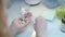 Doctor hand taking pills in pill dispenser. Woman sort drugs in organizer