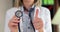Doctor hand with thumbs up holds stethoscope