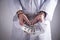 Doctor with handcuffs and money. Medical crime