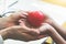 Doctor hands holding and giving red massage heart to patient little children for recover from sickness. Hospital and Healthcare