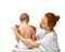 Doctor hands pediatrician therapist making massage to child infant baby feet. Health care and medical concept