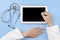 Doctor hands using stylus to touch tablet screen