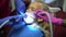 Doctor hands work with drill. Child open mouth during drilling caries in teeth