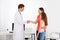 Doctor Handshaking Girl Mother