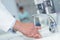 Doctor handwashing in hospital sink