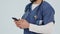 Doctor, healthcare and hands with phone in studio for online consulting, reading medical notification and mobile