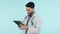 Doctor, healthcare and tablet for surgery planning, research or online consulting in studio on blue background