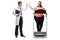 Doctor high-fiving an overweight woman exercising on a treadmill