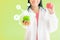 Doctor hold apple with vitamin icons