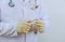 Doctor holding an ampoule for vaccination treatment in his hand focus on the ampoule