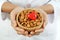 Doctor holding a bowl of almonds and heart shape