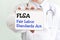 Doctor holding a card with text FLSA Fair Labor Standards Act medical concept