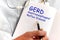 Doctor holding a card with text GERD, medical concept