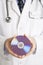 Doctor holding compact disc.