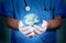 Doctor holding earth in hand.Global medicine concept